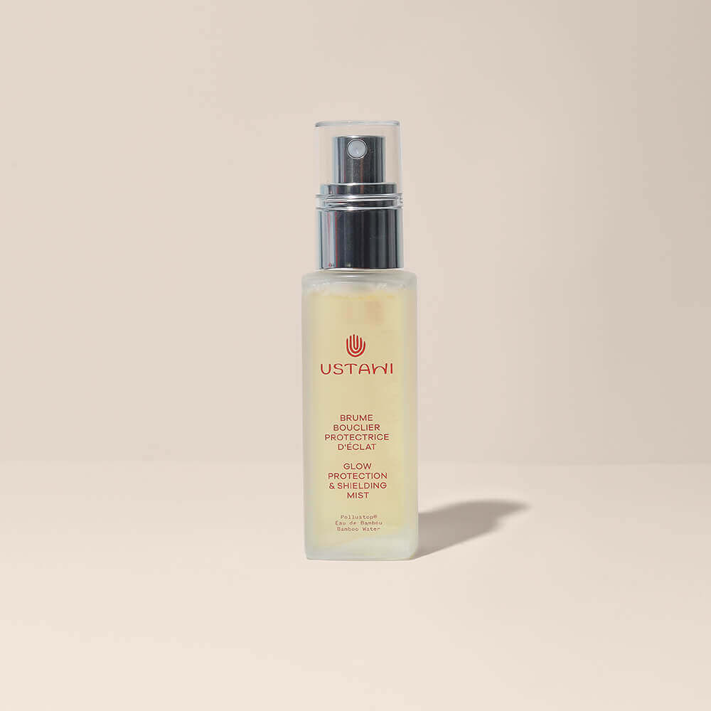 Refreshing facial Glow Protection &amp; Shielding Mist spray in elegant bottle against a serene background